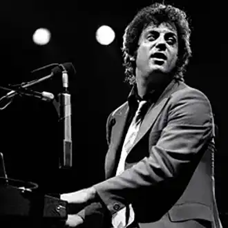 Billy Joel at piano on stage