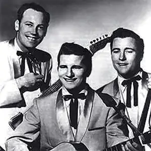 Johnny Burnette and the Rock 'N' Roll Trio posing with guitars