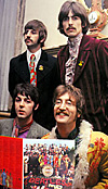 The Beatles holding Sgt. Peppers album