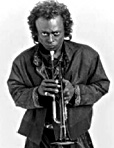 Miles Davis holding trumpet